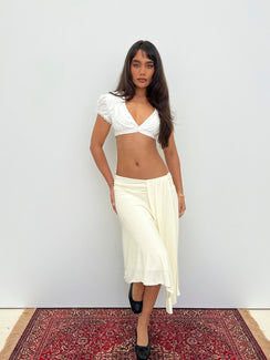 Crafted from cornsilk fabric, the Iselda Draped Midi Skirt Cream in womens-skirts features asymmetry Princess Polly