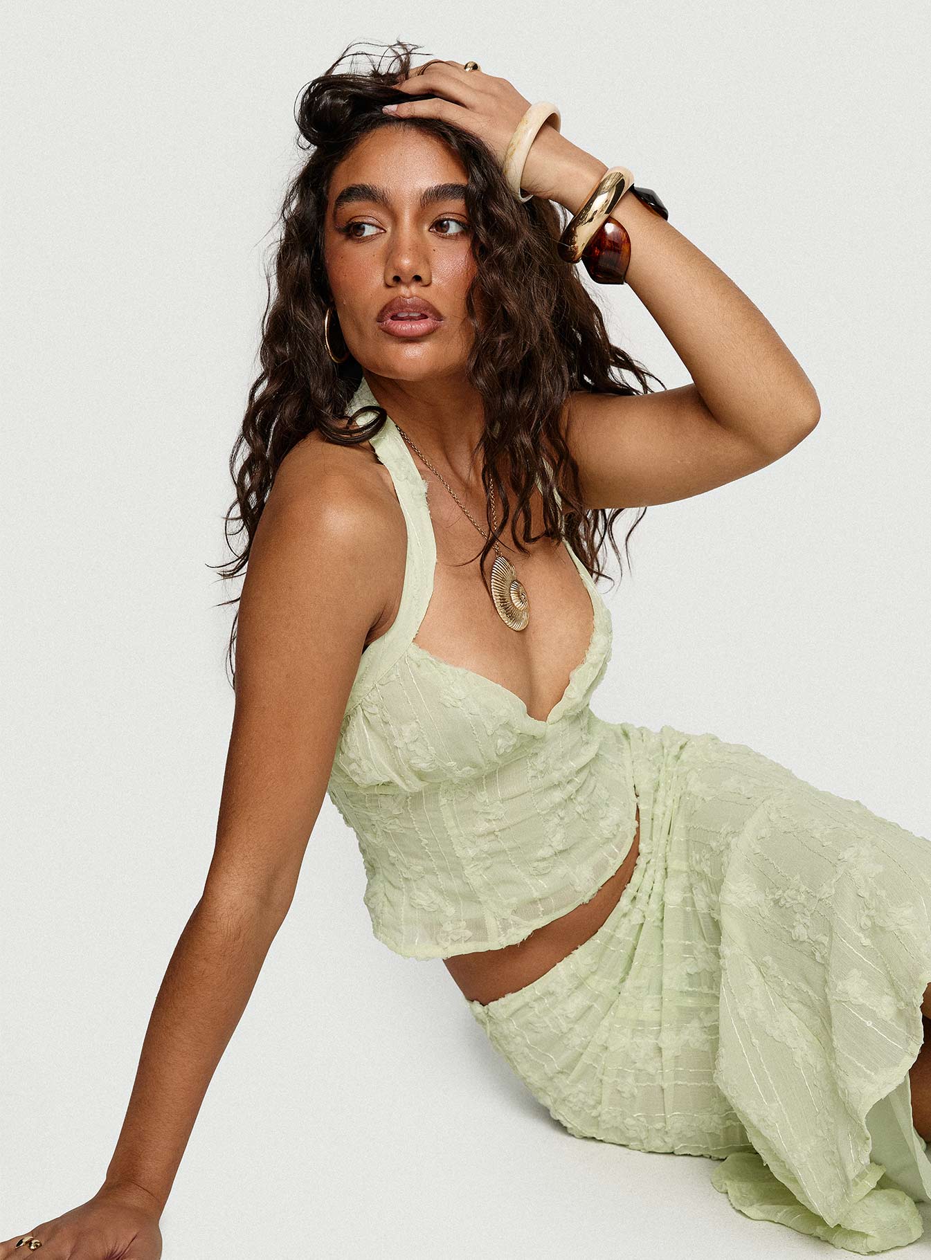 front view of model wearing Princess Polly Aspyn Halter Top Sage Sleeveless Plunger 