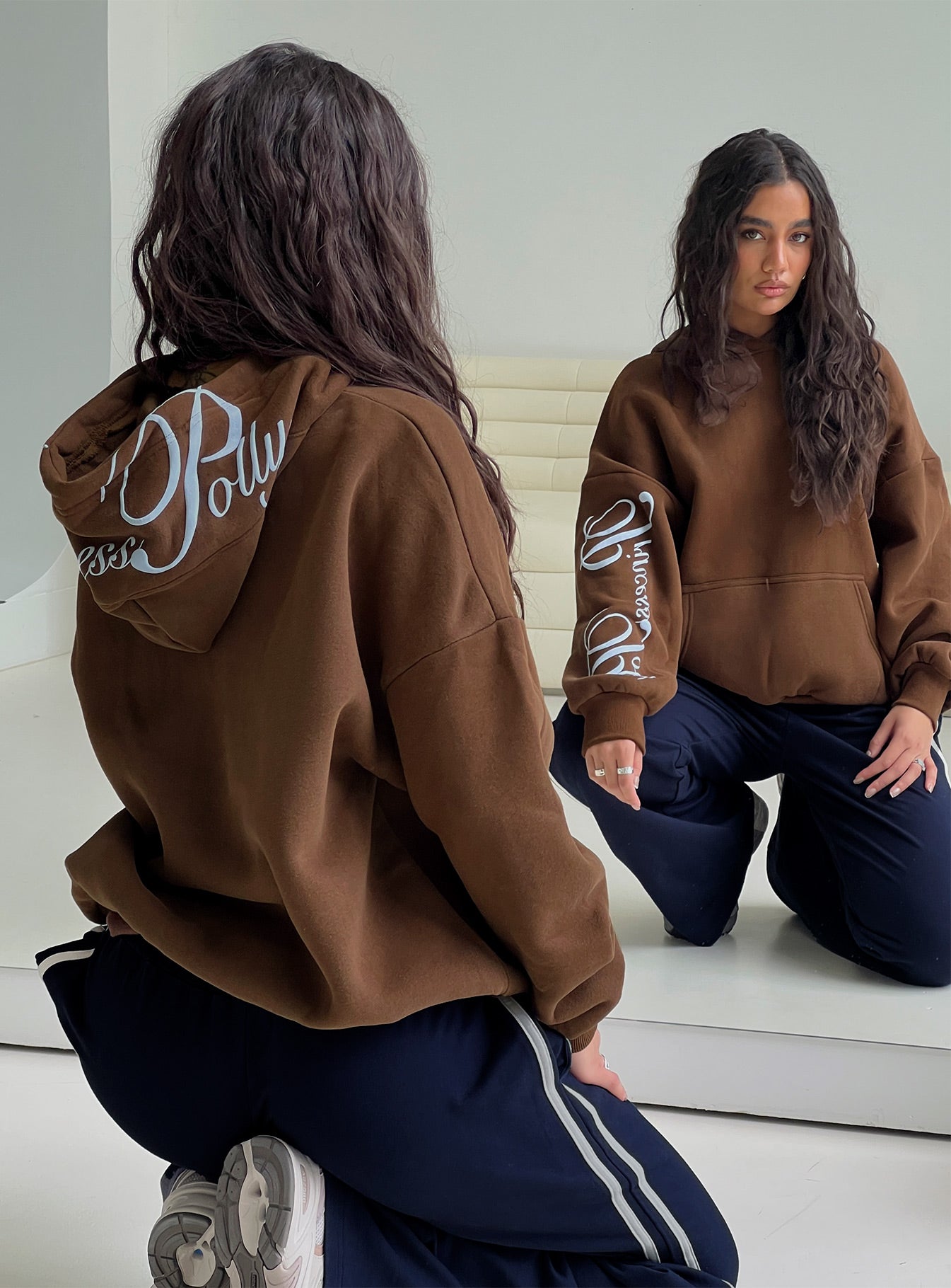 back view of model wearing Princess Polly Princess Polly Script Text Graphic Hoodie Brown / Blue Long 