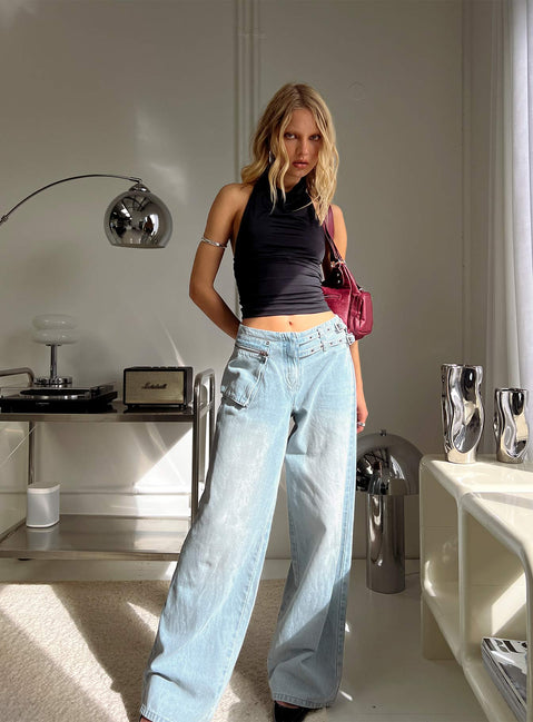 side view of model wearing Princess Polly Paltrow Mid Rise Wide Leg Cargo Jeans Faded Blue Wash Mid Rise Jeans 