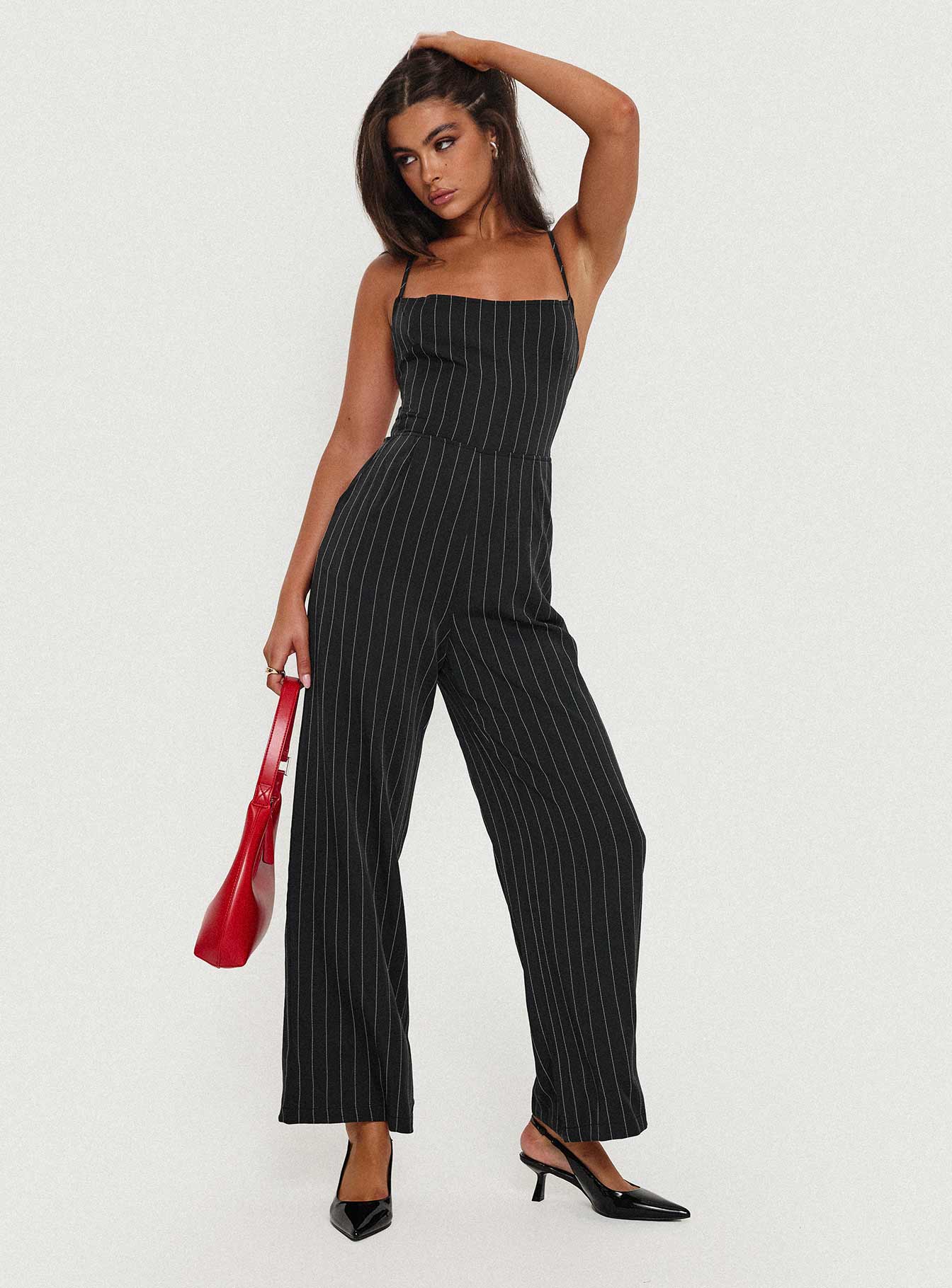 Jumpsuit fastening at back, invisible zip fastening, twin hip & back pockets, partially exposed back, straight leg