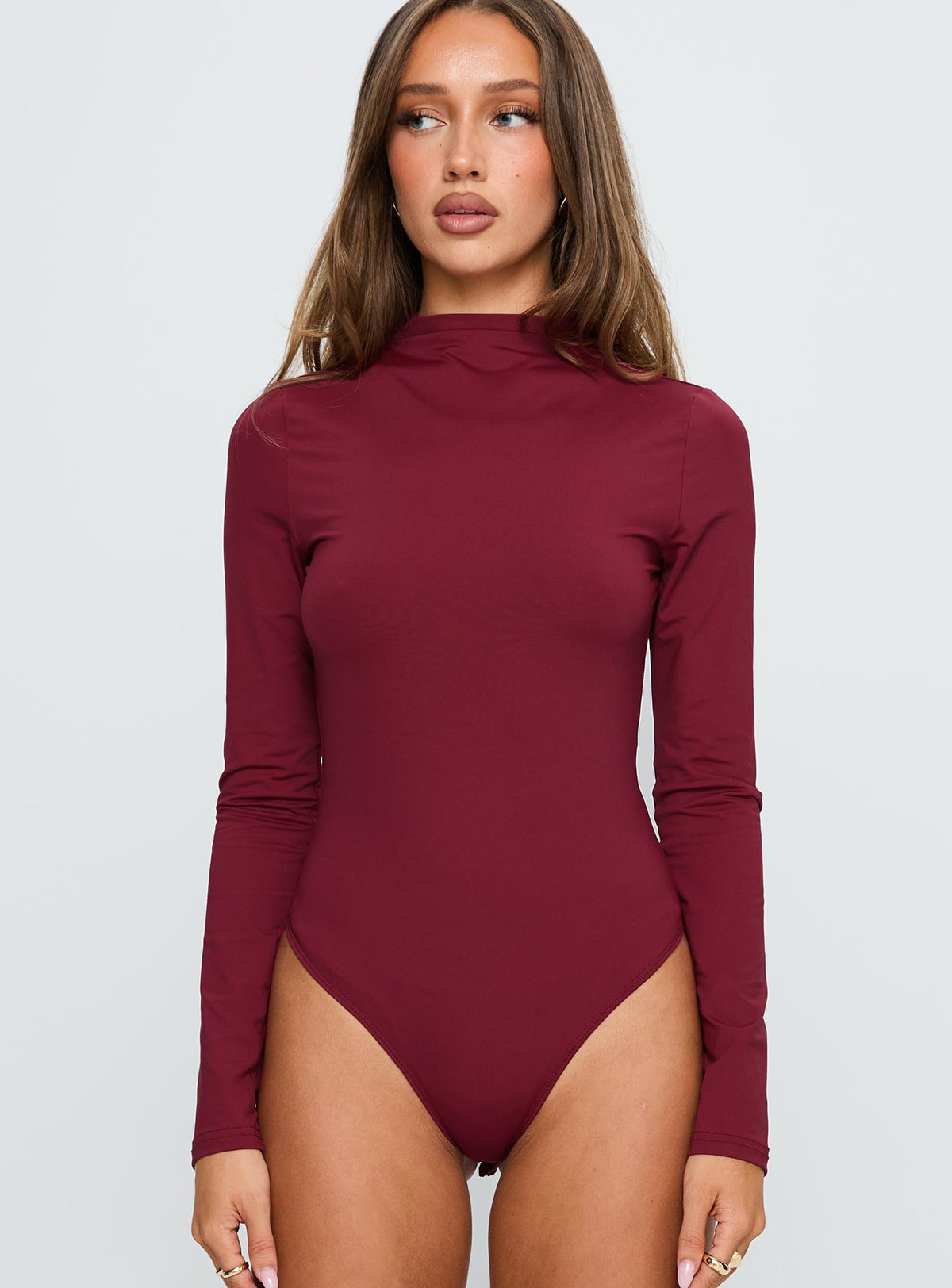 front view of model wearing Princess Polly Augustness Long Sleeve Bodysuit Burgundy Long Sleeve Tops Bodysuit 