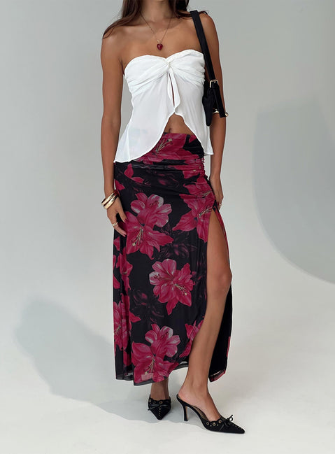   side view of model wearing Princess Polly Cooperi Maxi Skirt Black / Red Floral Maxi 