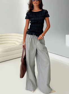 front view of model wearing Princess Polly Spoiler Alert Ruched Top Black Short Sleeves Scoop Neck 