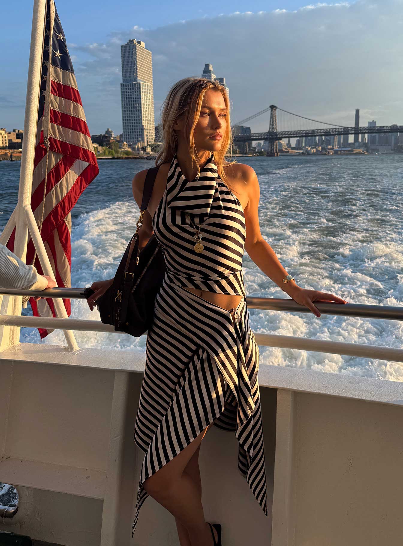   side view of model wearing Princess Polly Allure Midi Skirt Noir Stripe Midi Skirts 