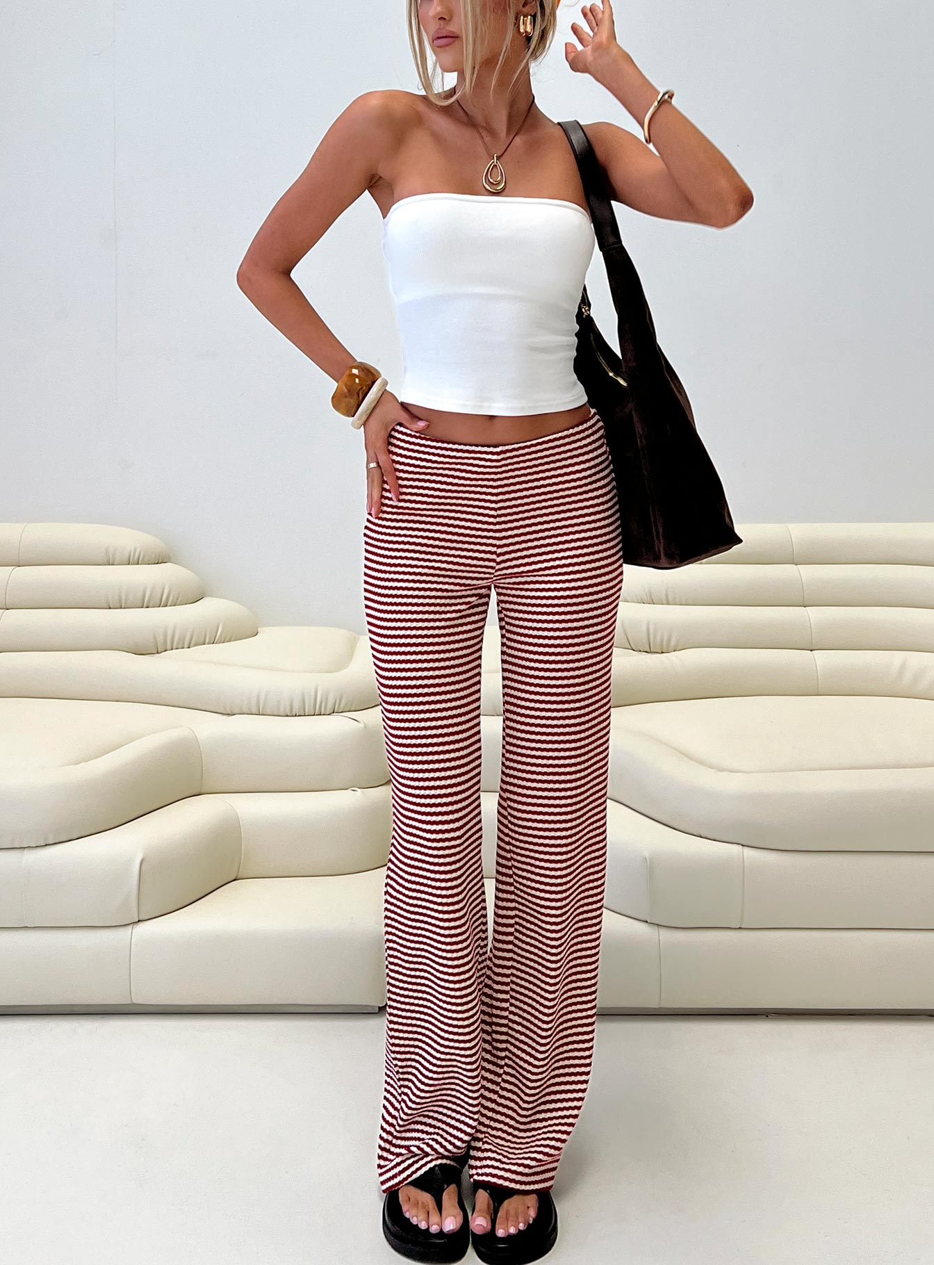 front view of model wearing Princess Polly Next To Me Lounge Pant Red / White Stripe Low Rise Pants 