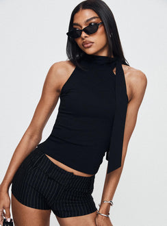 back view of model wearing Princess Polly Minette Micro Shorts Black Pinstripe Low Rise Shorts 