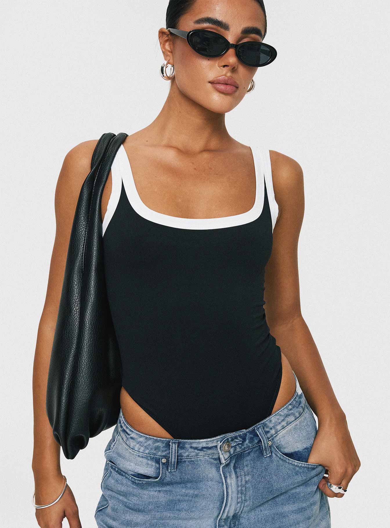 front view of model wearing Princess Polly Astrea Bodysuit Black / White Sleeveless 