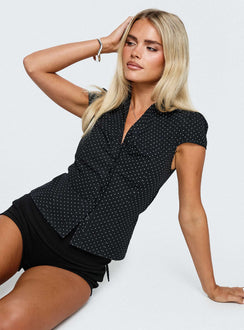 side view of model wearing Princess Polly Arianwyn Short Sleeve Shirt Black Polka Short Sleeves V-Neck 