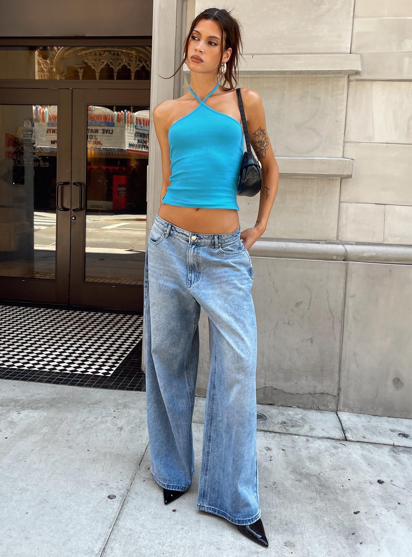 front view of model wearing Princess Polly Baseline Halter Rib Top Blue Sleeveless 