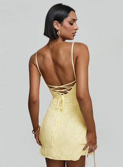 back view of model wearing Princess Polly South Of France Mini Dress Yellow Petite Square Neck 