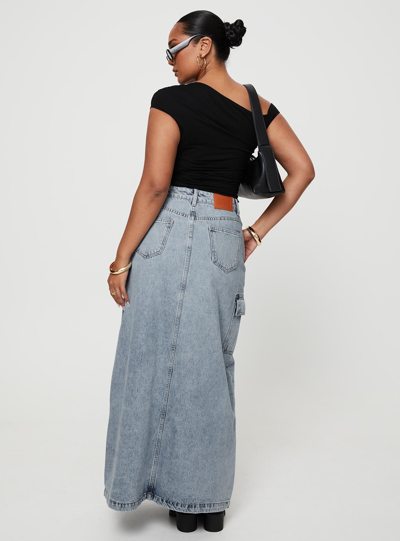 back view of model wearing Princess Polly McGuane Denim Midi Skirt Petite Maxi 