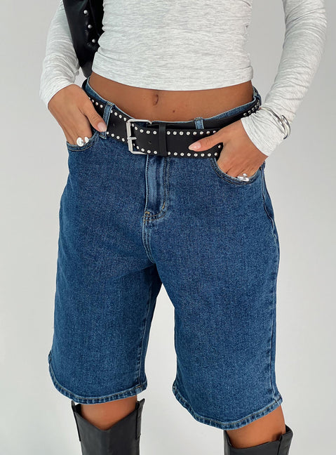 front view of model wearing Princess Polly Retro Dream Mid Rise Longline Denim Shorts Mid Wash Low Rise Shorts 