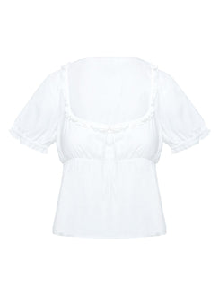 side view of model wearing Princess Polly Elizabette Puff Sleeve Top White Short Sleeves Scoop Neck 