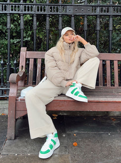 Puffer jacket Oversized fit Zip front fastening High neckline Relaxed sleeves with elasticated cuffs Single internal pocket Fully lined