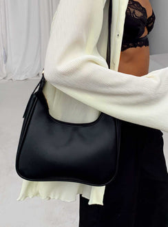 Shoulder bag  Faux leather material  Adjustable shoulder strap  Gold-toned hardware   Zip fastening  Single internal zip pocket  Flat base 