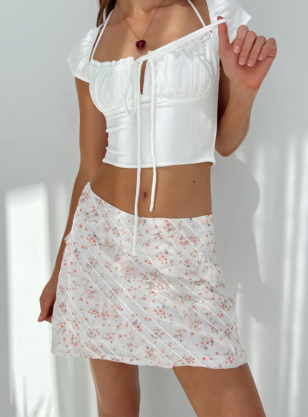 Floral mini skirt Frill detail, invisible zip fastening at side Non-stretch, fully lined 