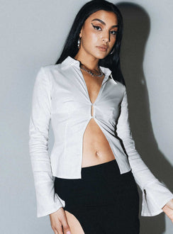 Long sleeve shirt Classic collar V-neckline Button fastening at front Split hem Open back design with lace-up fastening Slits at cuffs