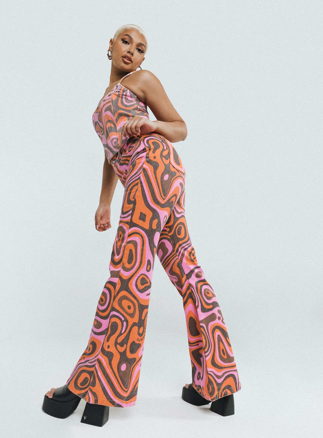 Jeans Printed design  High waisted  Zip & Button fastening  Belt looped waist  Classic five pocket design  Flared leg 