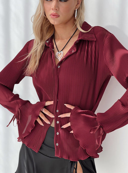 Long sleeve shirt Relaxed fit, plisse material, classic collar, bow detail at cuff, lettuce edge hem  Button fastening at front