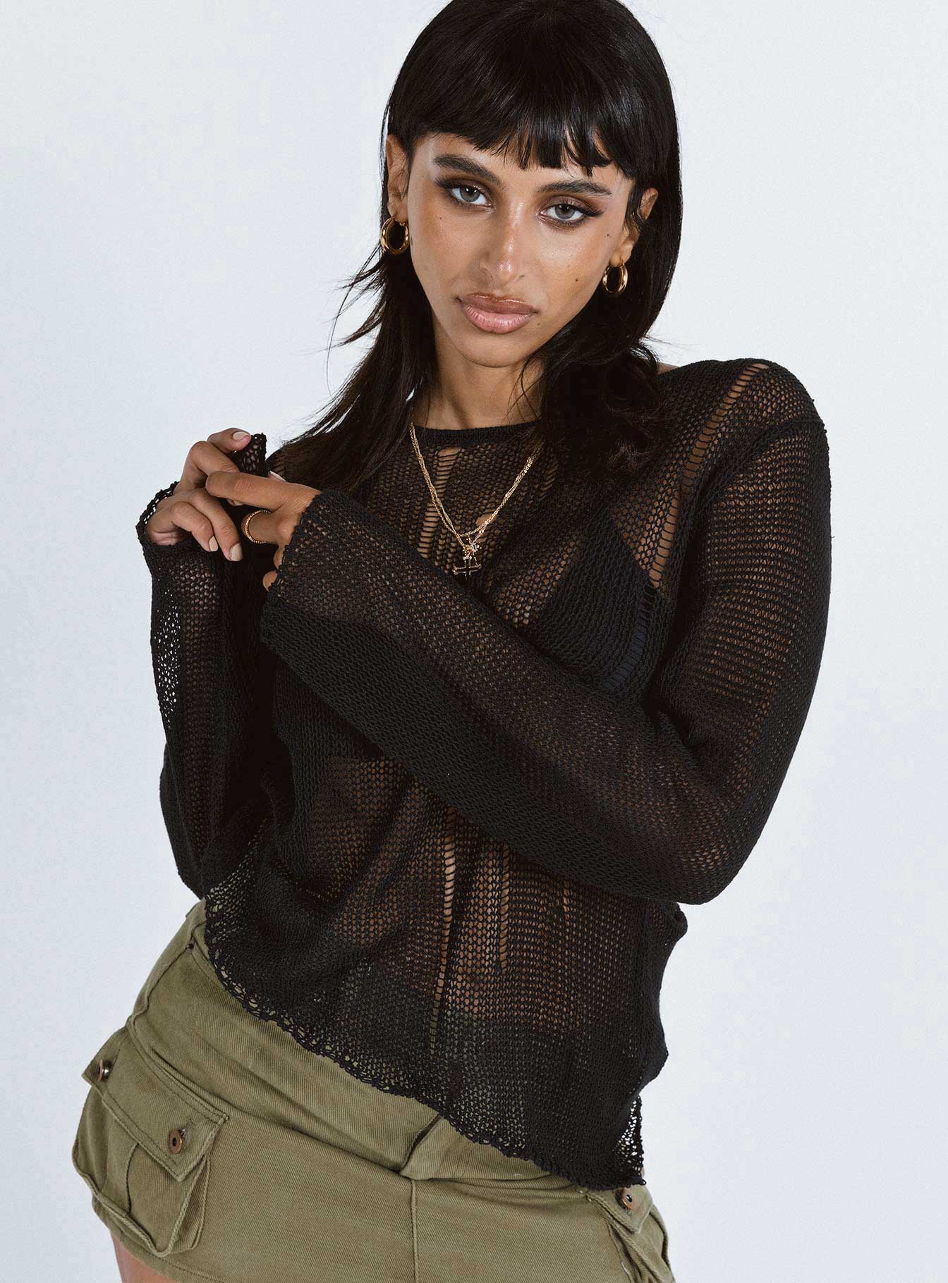 Sweater Sheer knit material Wide neckline Asymmetrical hem Good stretch Unlined 