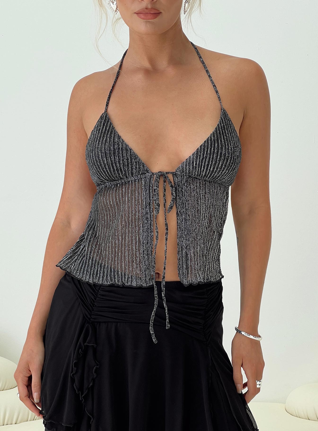 Plisse glitter top Sheer material, plunging neckline, split hem, halter neck tie, tie fastening at bust Good stretch, lined bust