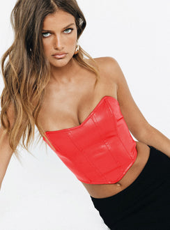 Red bustier Faux leather material Strapless design  Boning through front  Pointed hem  Zip fastening at back  Fully lined 
