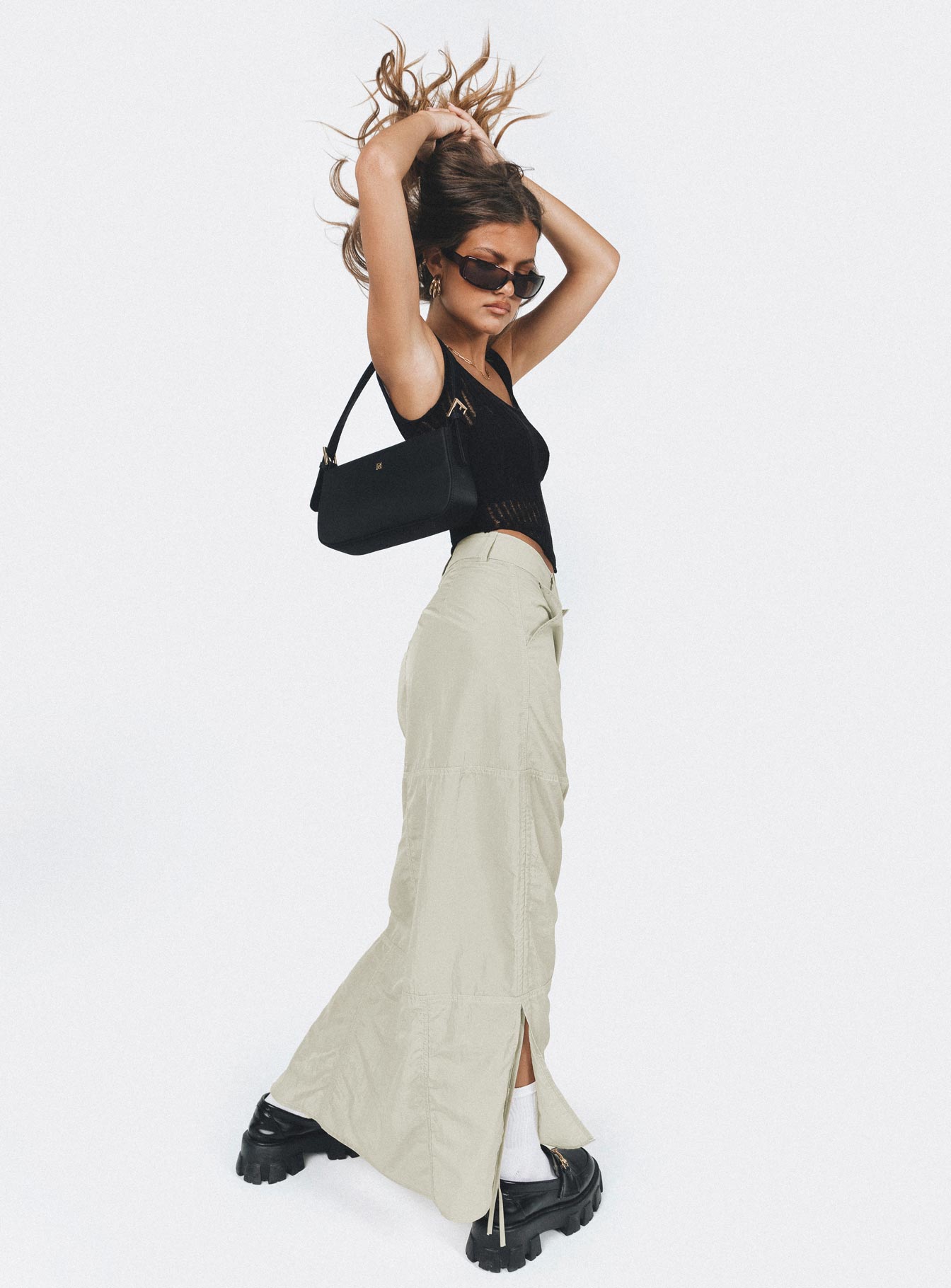 Maxi skirt Windbreaker material Belt looped waist Zip & hook & eye fastening Twin hip pockets Drawstring ties on side