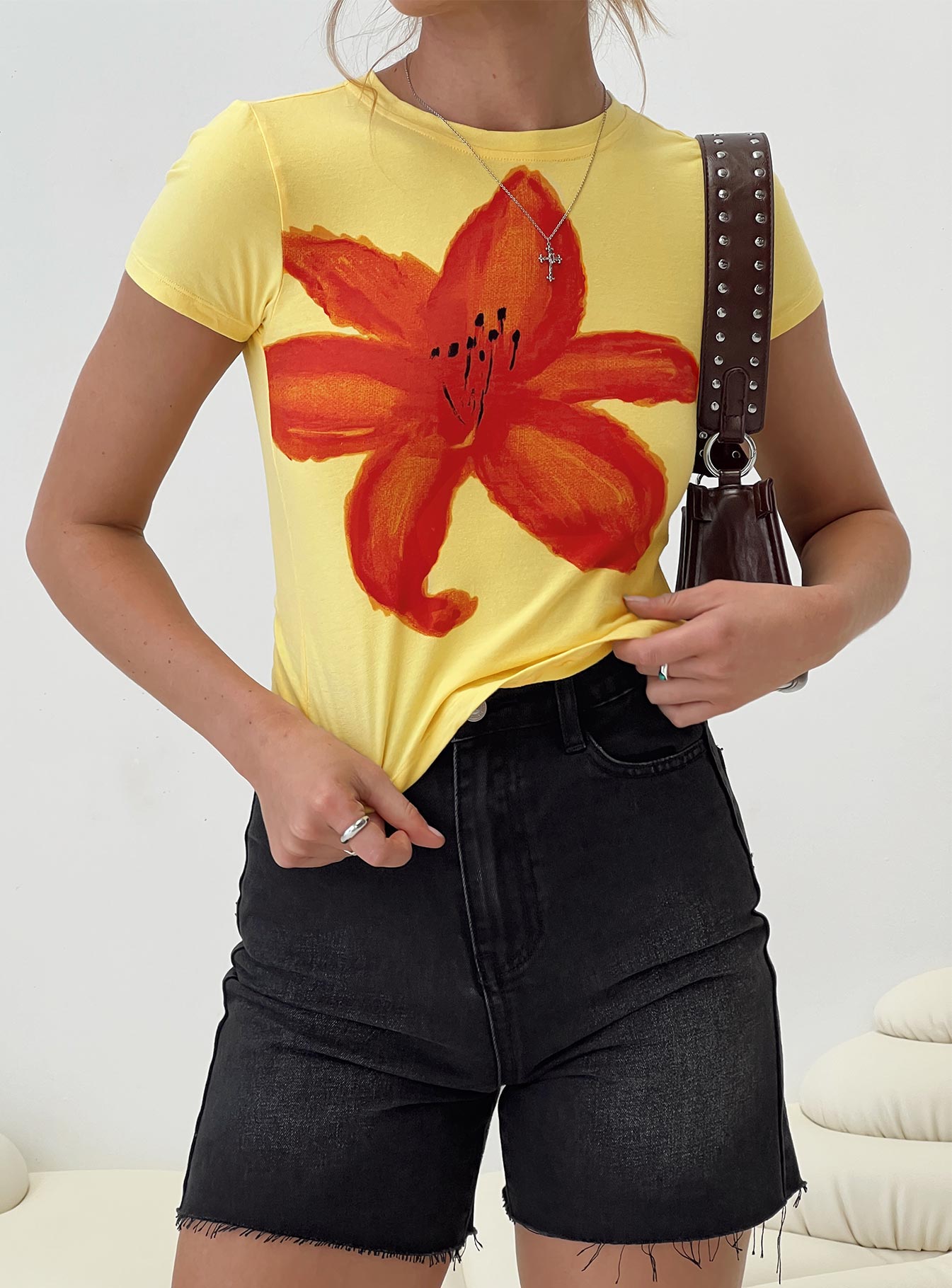 Graphic print tee Cap sleeve, adjustable cut-outs at back with tie fastening