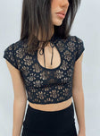 Top Sheer lace material Tie fastening at neck Keyhole cut out Cap sleeves Non-stretch