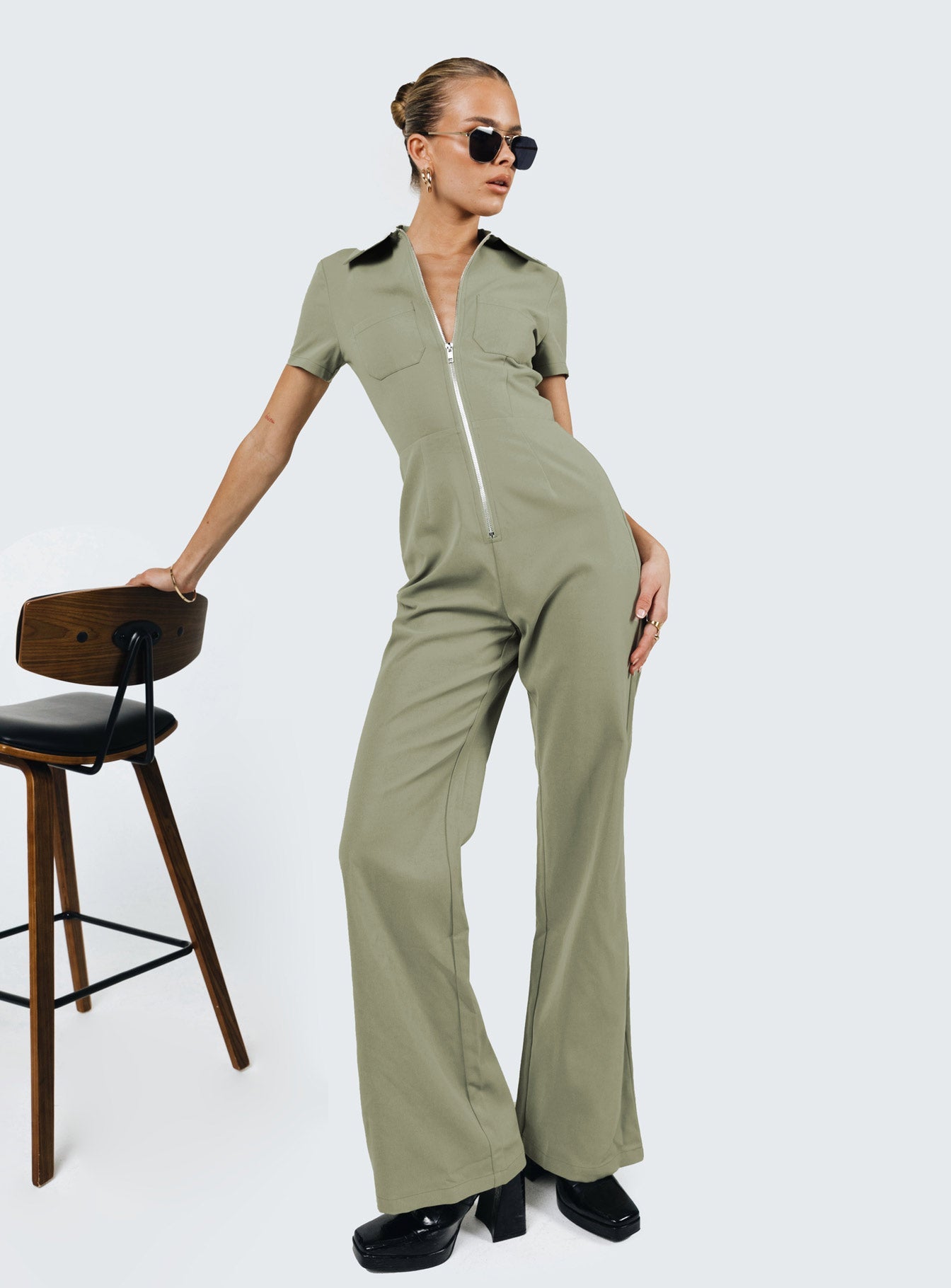 Jumpsuit Classic collar Zip fastening at front Twin chest pockets Straight leg