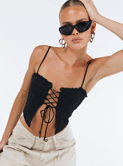 Crop top Lace material  Ruffle neckline  Adjustable shoulder straps  Inner silicone strip at bust  Lace up fastening at front Non stretch Fully lined 