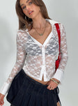 Long sleeve top Collared, lace material, button fastening Good stretch, unlined, sheer