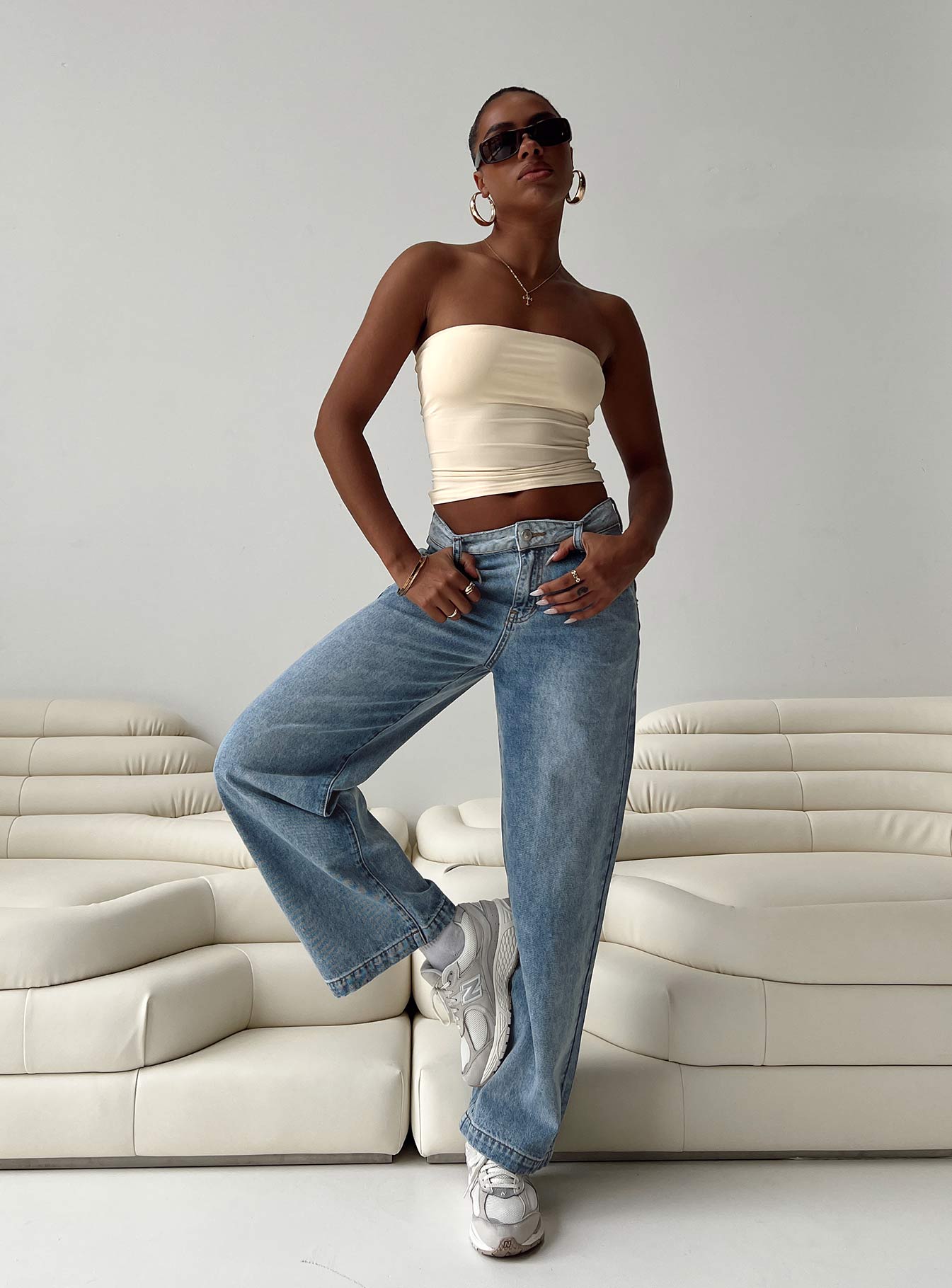 Jeans Mid wash denim High rise Belt looped waist Zip and button fastening Four classic pockets Branded patch at back Straight leg