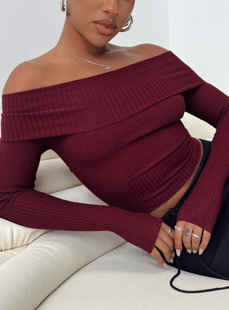 Long sleeve sweater Ribbed material Off the shoulder design Good stretch Unlined 