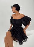 Black mini dress Sheer material Off the shoulder design Puff sleeve Elasticated bands at waist