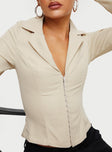 Shirt Slim fitting, lapel collar, long sleeves, princess panels, flare out at hem Hook & eye fastening 