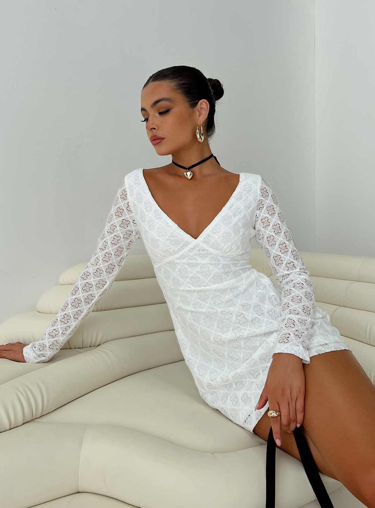 Long sleeve dress Lace overlay, v-neckline, tie fastenings at back, partially exposed back, invisible zip fastening at the side, slightly sheer Good stretch, lined body, sheer sleeves