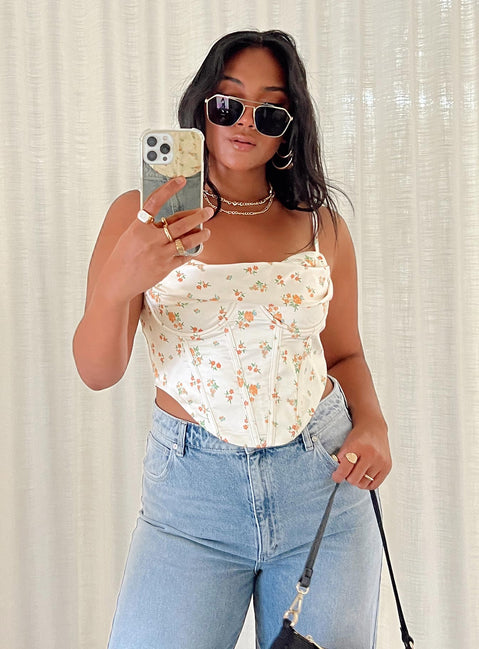 Corset top Silky material Floral print Adjustable shoulder straps Cowl neckline Wired bust Boning throughout Pointed hem