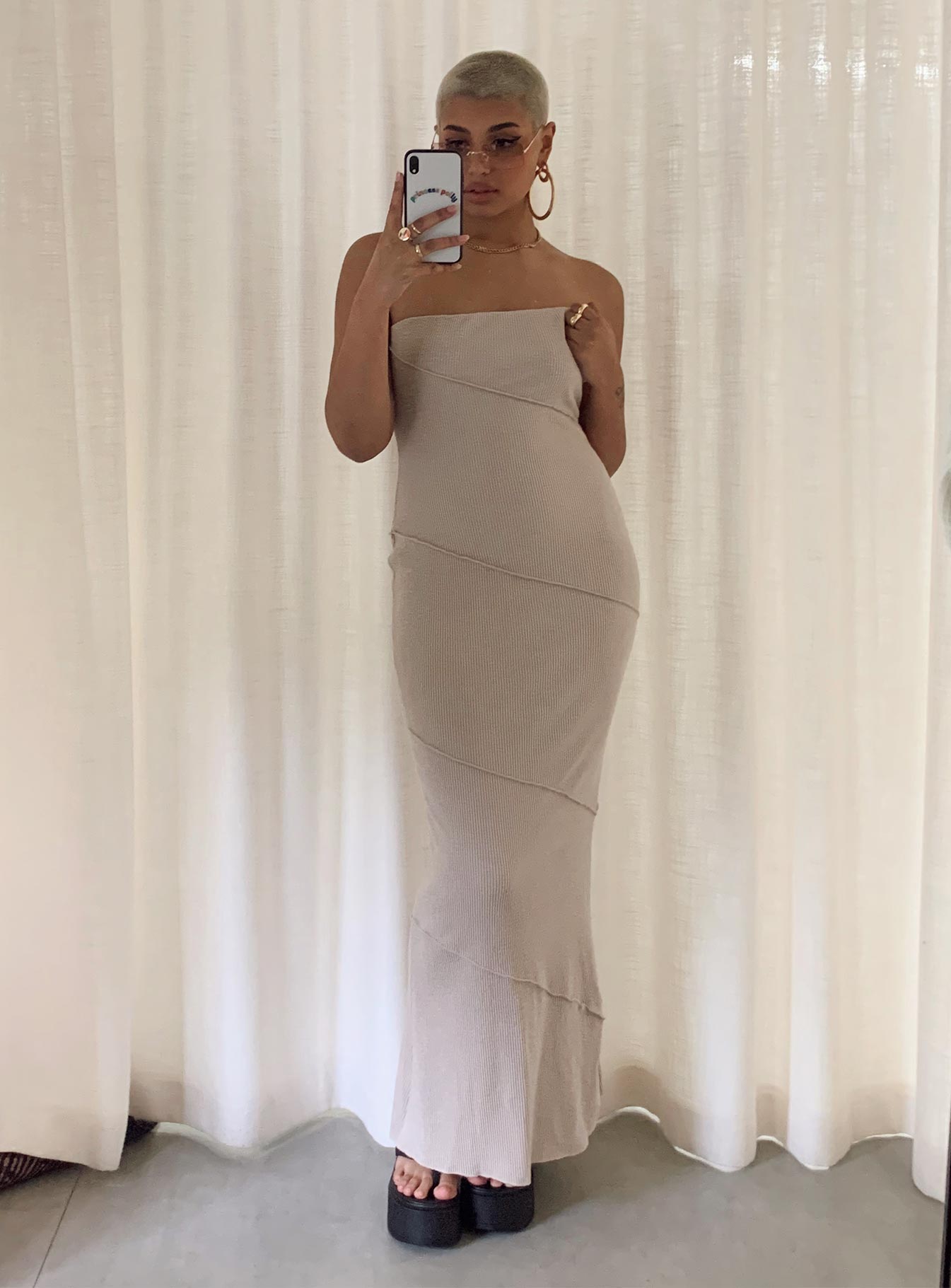 Strapless midi dress Soft knit material Diagonal stitching Inner silicone strip at bust Invisible zip fastening at side Good stretch