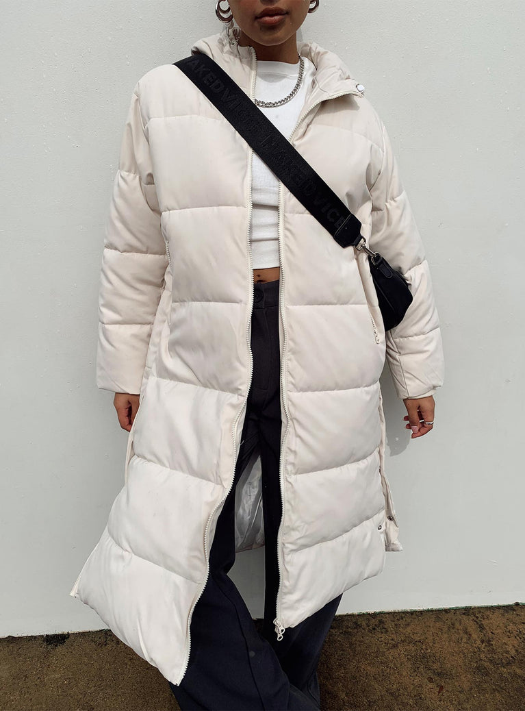 Longline puffer jacket Drawstring hood  Zip front fastening  Twin hip pockets  Press button fastening down sides  Fully lined 