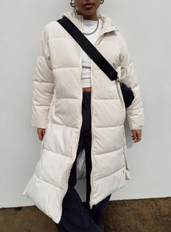 Longline puffer jacket Drawstring hood  Zip front fastening  Twin hip pockets  Press button fastening down sides  Fully lined 