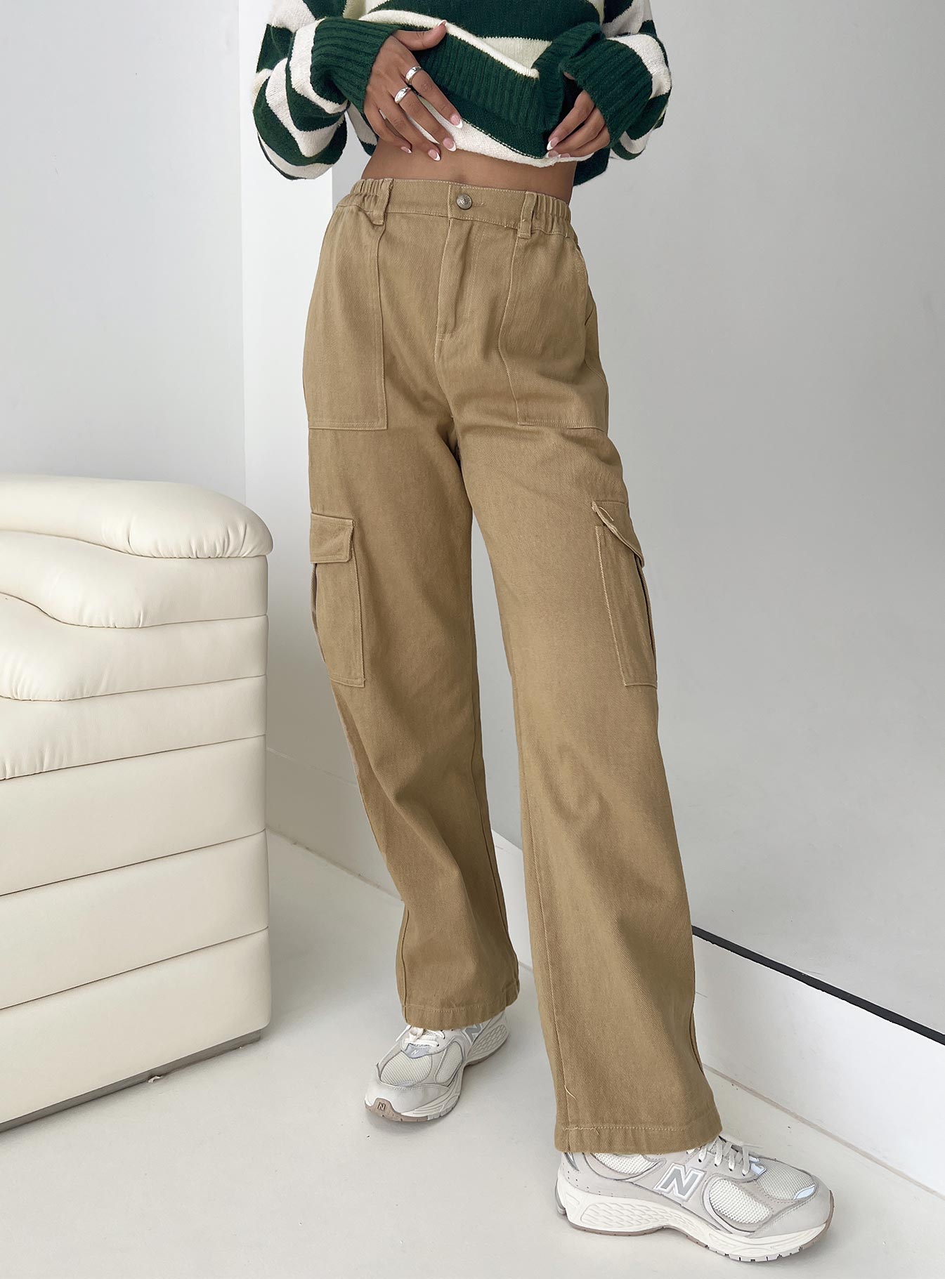 Straight leg cargo pants, denim material Belt looped waist, elasticated waistband at back, zip & button fastening, six pocket design Non-stretch, unlined 