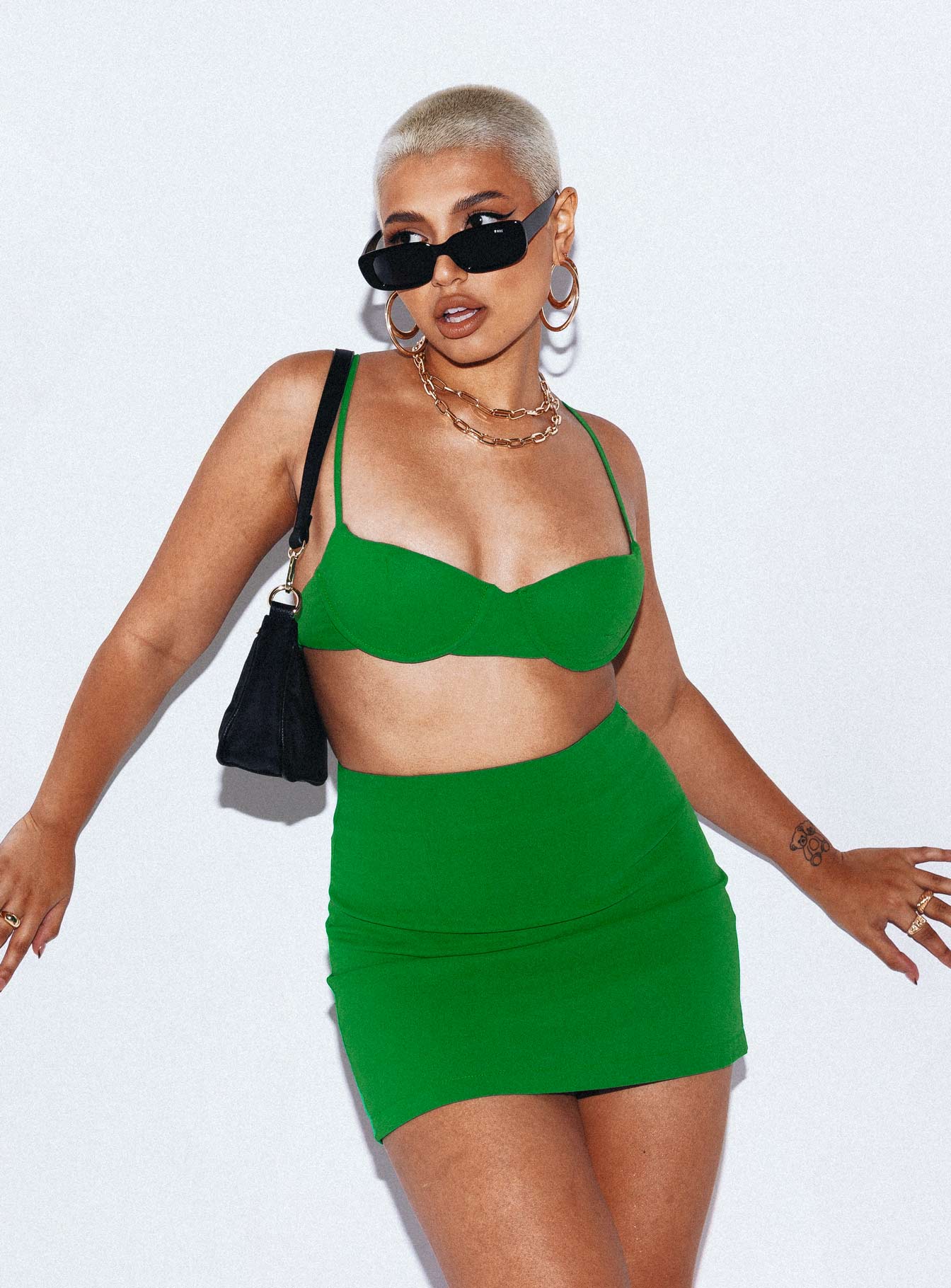 Matching set  100% polyester Bra top  Adjustable shoulder straps  Padded bust  Wired cups  Elasticated back  High waisted mini skirt  Invisible zip fastening at side 