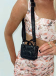 Black mini bag Faux leather material  Quilted look  Twin handles  Adjustable & removable crossbody strap 