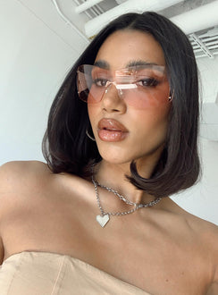 Sunglasses Frameless design  Pink tinted lenses Adjustable silicone nose pads 