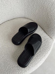 Black sandals Faux leather material Single wide upper Padded footbed Platform base