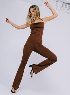 Jumpsuit  Slim fitting  Princess Polly Exclusive 92% recycled fibers 8% elastane  Thin shoulder straps  Straps can be worn crossed over or straight back  Elasticated waistband  Flared leg 