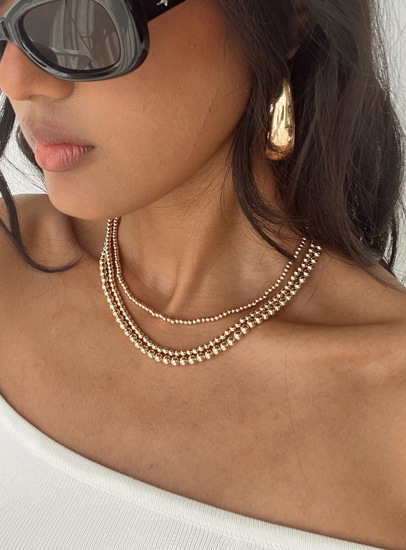 Gold-toned necklace Three seperate necklaces, lobster clasp fastening