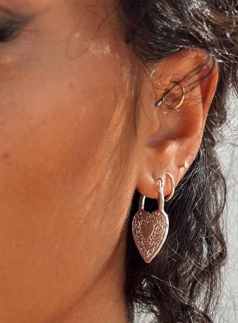 Earrings Hoop style  Silver-toned Latch fastening  Heart design